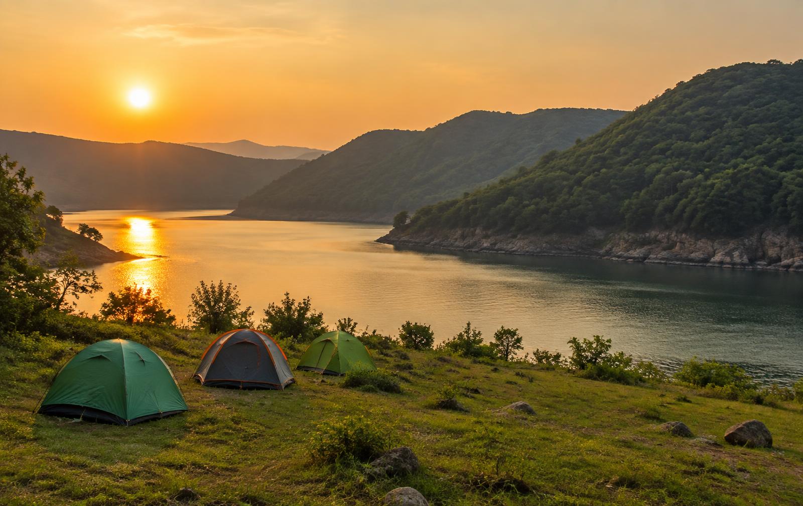 Tents by the Somasila backwaters at sunset